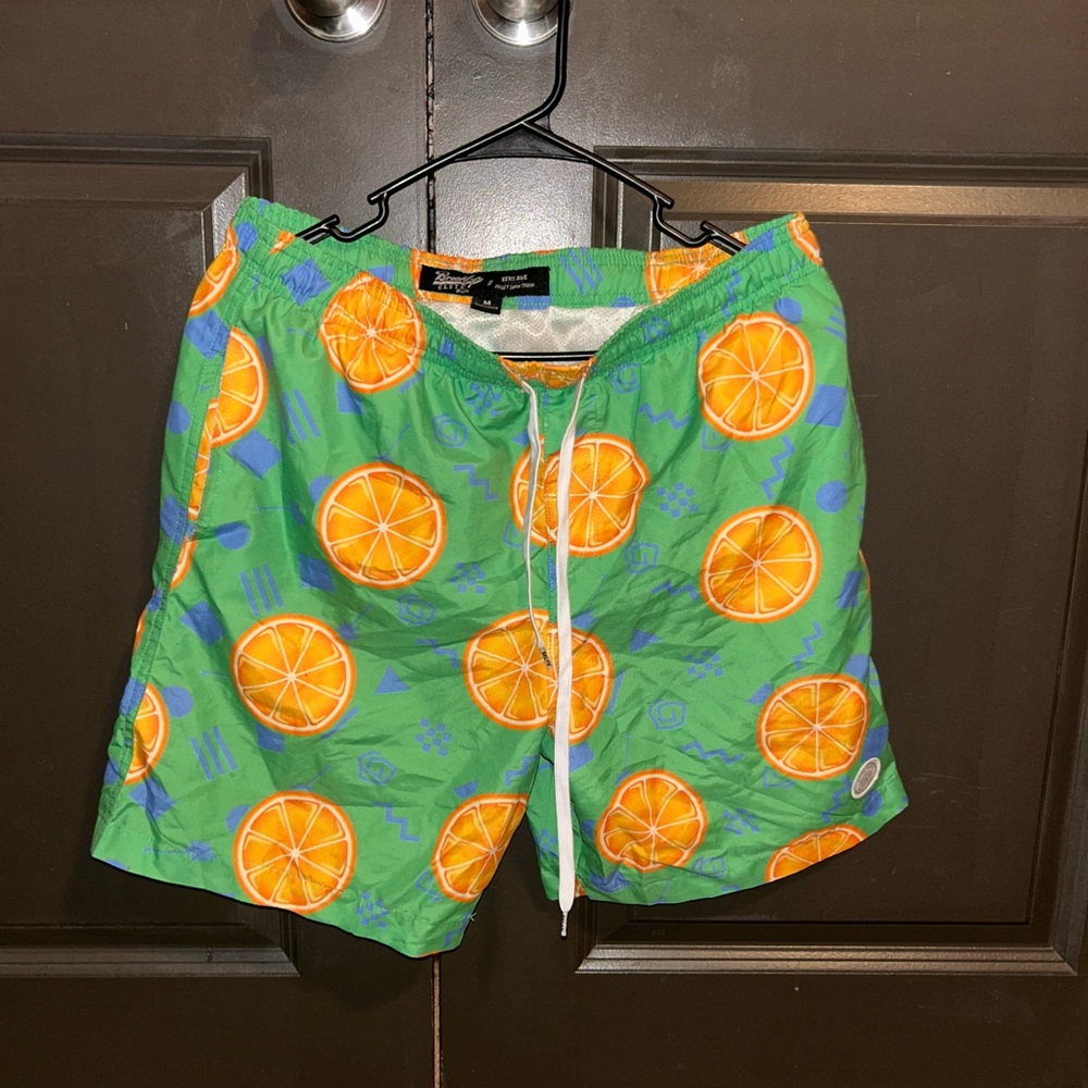 Nike Green Swim Trunks with Orange Print